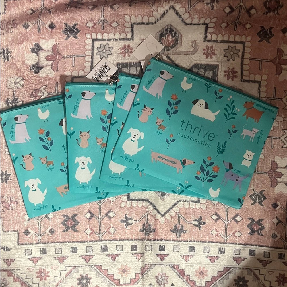 Thrive Causemetics Teal Dog Print Pouches